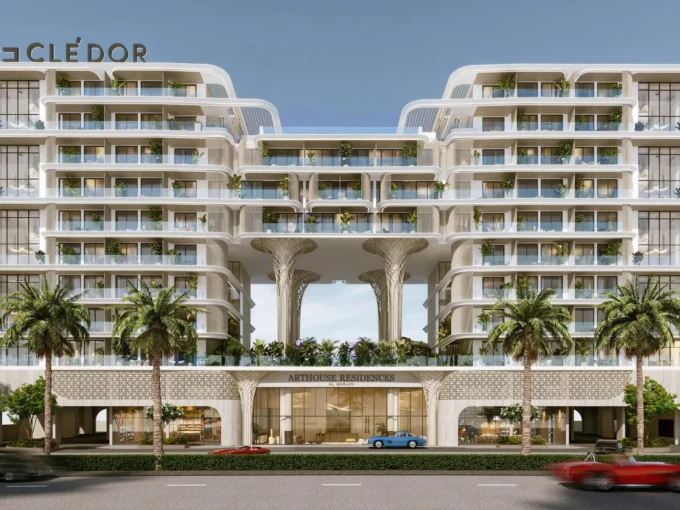 Modern façade of Arthouse Residences with lush balconies, palm trees, and elegant twin towers.