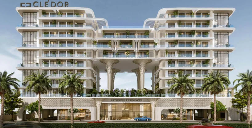 Modern façade of Arthouse Residences with lush balconies, palm trees, and elegant twin towers.