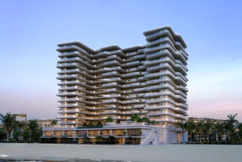 Modern beachfront tower with curved glass balconies, showcasing Aston Martin Residences at sunset.