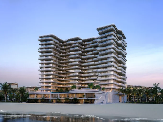 Modern beachfront tower with curved glass balconies, showcasing Aston Martin Residences at sunset.