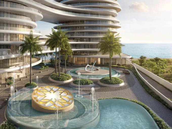 A luxurious waterfront view of La Mer Elie Saab with its modern architecture and serene surroundings.