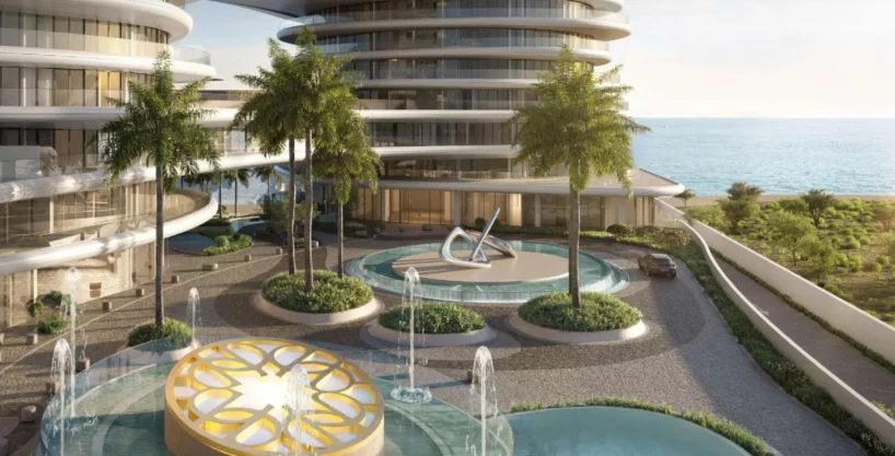A luxurious waterfront view of La Mer Elie Saab with its modern architecture and serene surroundings.