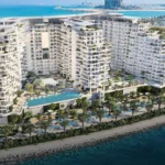 Aerial view of Miraggio, a luxury beachfront development with curved towers and infinity pools