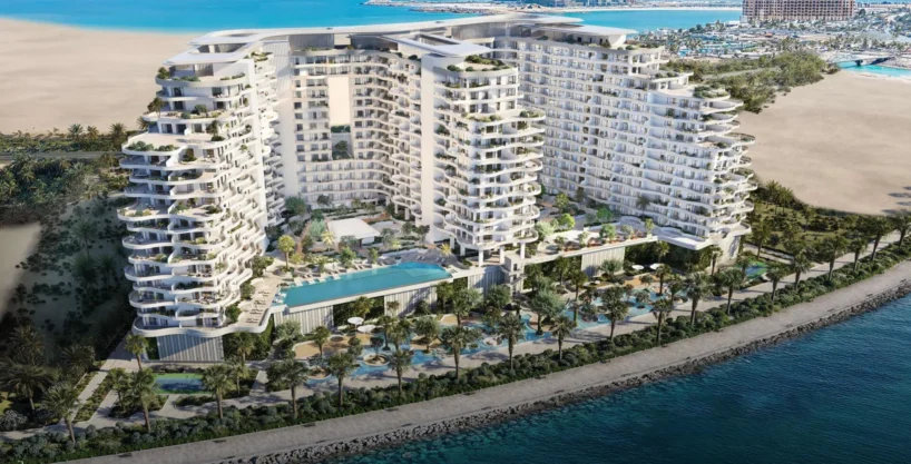 Aerial view of Miraggio, a luxury beachfront development with curved towers and infinity pools
