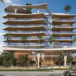 A futuristic Ola Residences building with wavy concrete elements and large balconies is seen from the street.