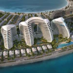 Oystra by Richmind: luxury resort with curved white buildings, villas, and ocean views.