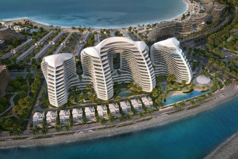 Oystra by Richmind: luxury resort with curved white buildings, villas, and ocean views.