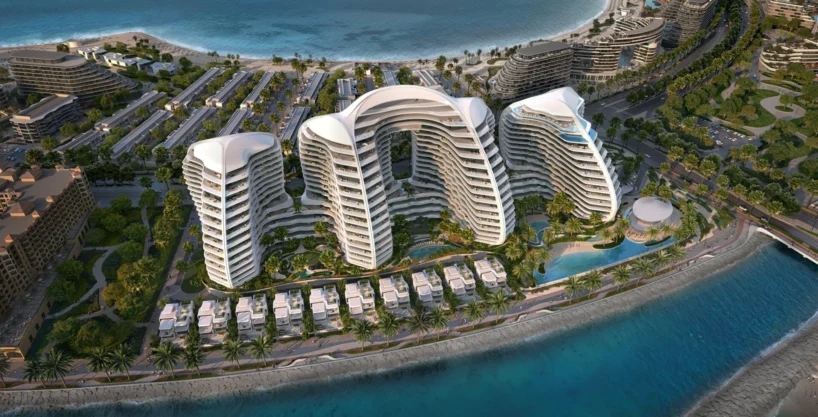 Oystra by Richmind: luxury resort with curved white buildings, villas, and ocean views.