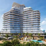 A luxurious Pelagia building with curved balconies stands tall, with a pool and palm trees in front.