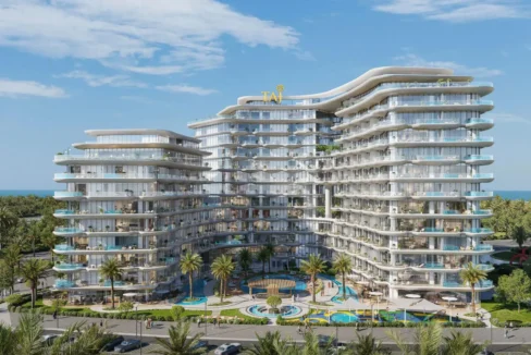 A luxurious, multi-story building, "Taj Wellington Mews", with curved balconies and a central pool area, surrounded by palm trees.