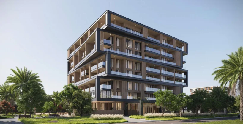 A modern Uno Luxe building with wooden facades and glass balconies is surrounded by lush greenery.