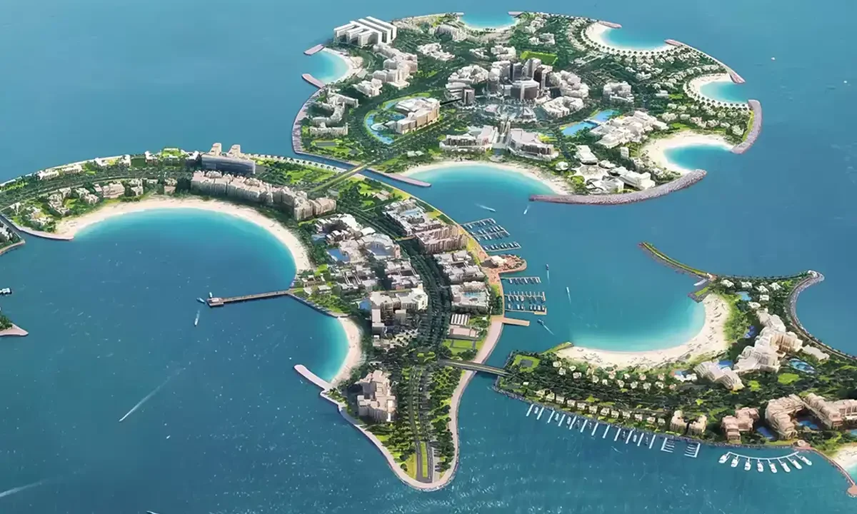 Aerial view of Al Marjan Island, a man-made archipelago with resorts, beaches, and residential buildings.