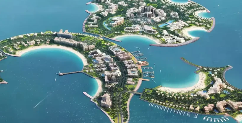 Aerial view of Al Marjan Island, a man-made archipelago with resorts, beaches, and residential buildings.